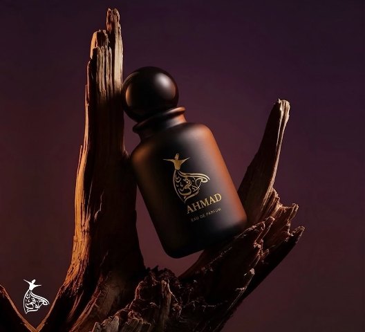 Ahmad eau de parfum bottle resting on driftwood